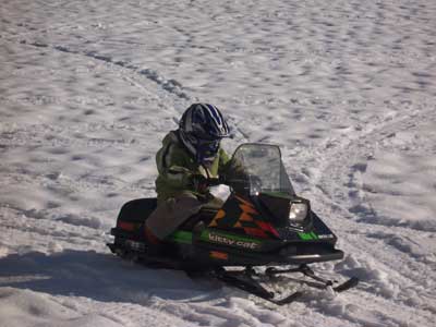 Kid snowmobiling
